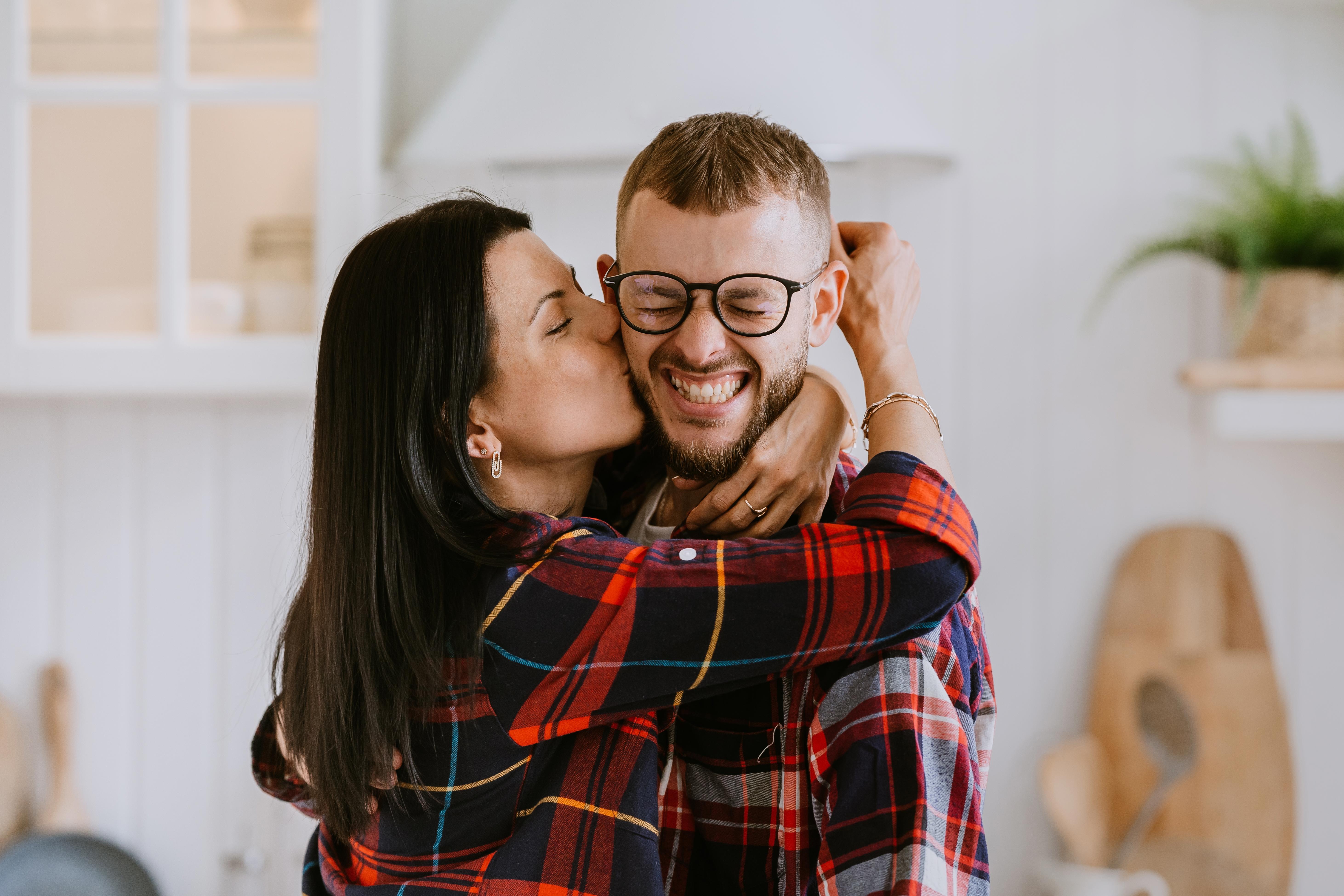 Happy couple moving into their first home