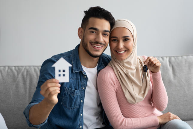 couple happy to have bought a new home