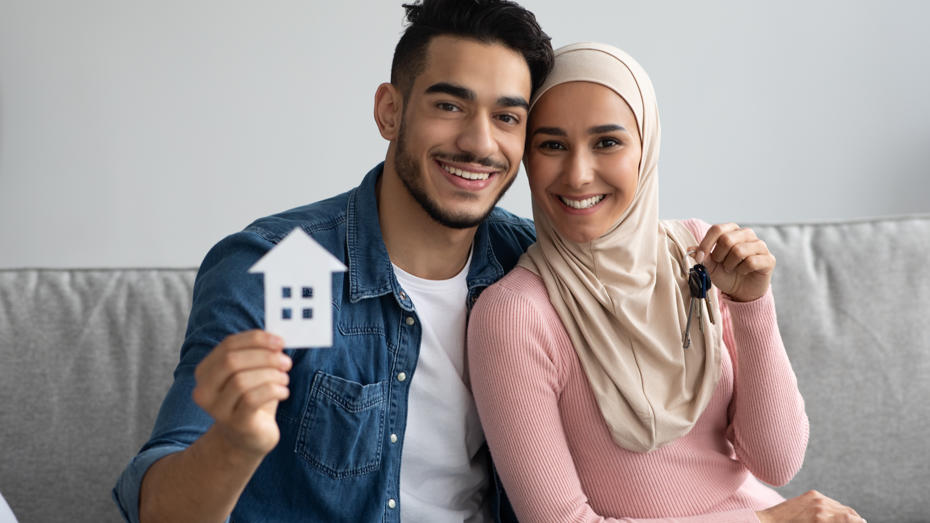 couple happy to have bought a new home